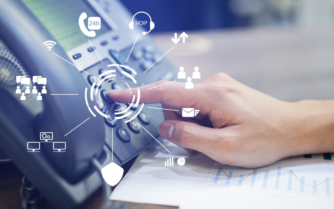 GR IT Services engineer configuring an IP telephone system at a Dubai office